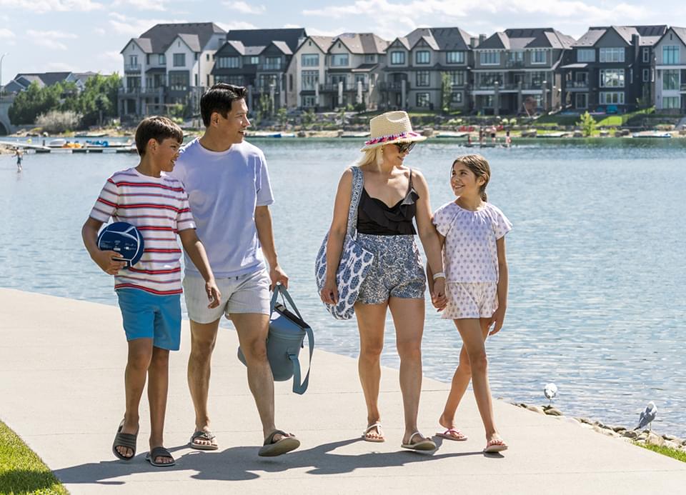 Family of 4 walking on pathway along Mahogany Lake